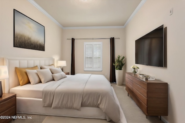 bedroom with ornamental molding and light colored carpet