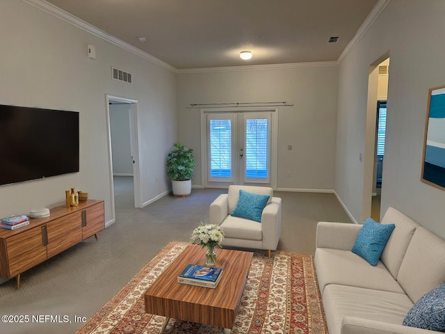 living area with crown molding, baseboards, visible vents, and light colored carpet