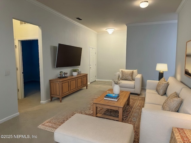 living room featuring light carpet, ornamental molding, and baseboards