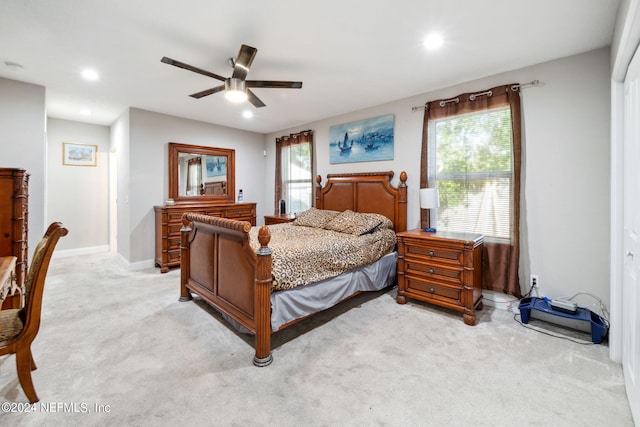 carpeted bedroom with ceiling fan