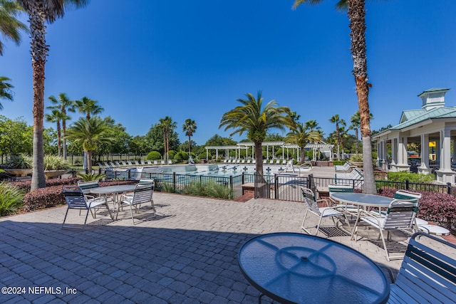 view of patio / terrace featuring a community pool