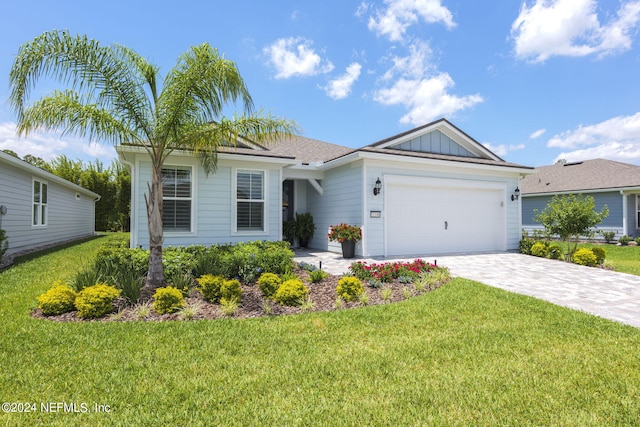 ranch-style home featuring a garage and a front lawn