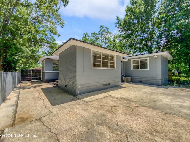 rear view of property featuring a patio area