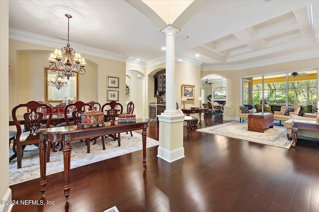 dining room featuring dark wood-type flooring, an inviting chandelier, coffered ceiling, and decorative columns