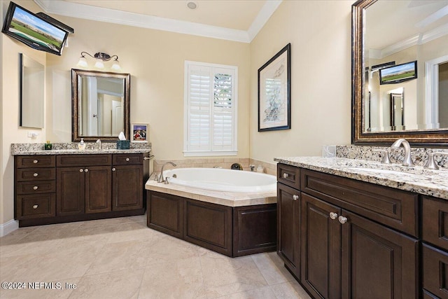 bathroom featuring a bathtub, dual vanity, crown molding, and tile floors