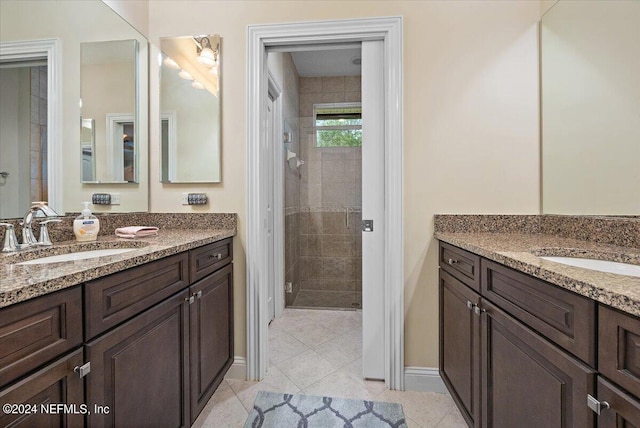 bathroom with tile flooring and vanity