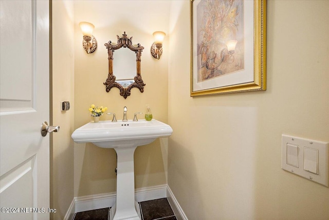 bathroom with tile flooring