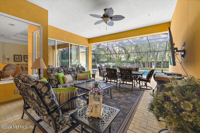 sunroom with ceiling fan