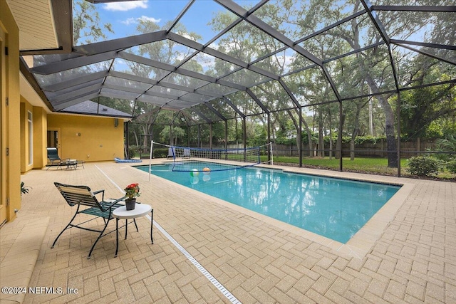 view of swimming pool with a lanai and a patio