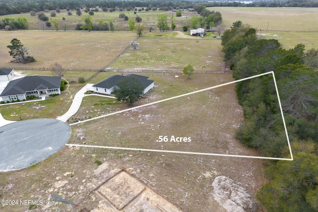 birds eye view of property featuring a rural view