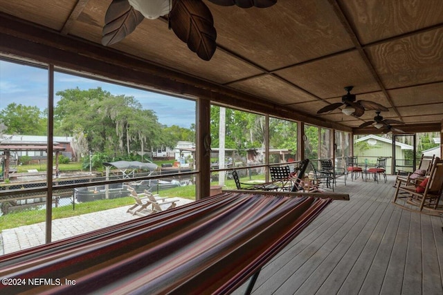 wooden terrace featuring ceiling fan