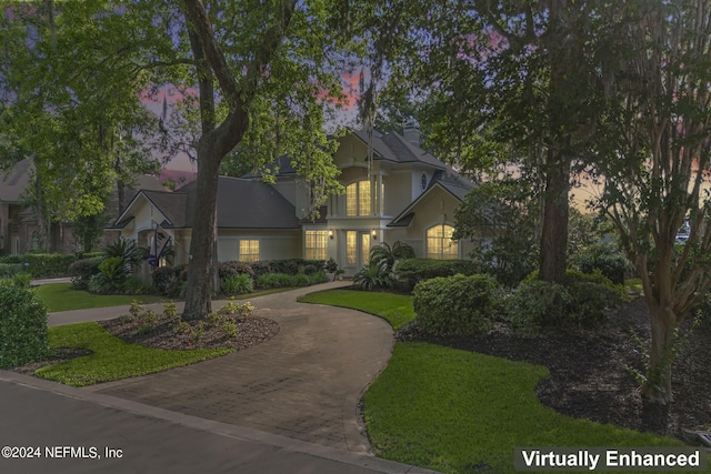 view of front of property with a yard