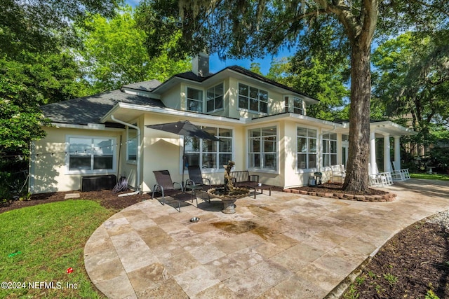 back of property with a patio area