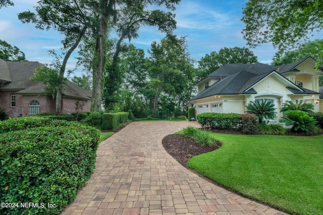 exterior space featuring a yard and a garage