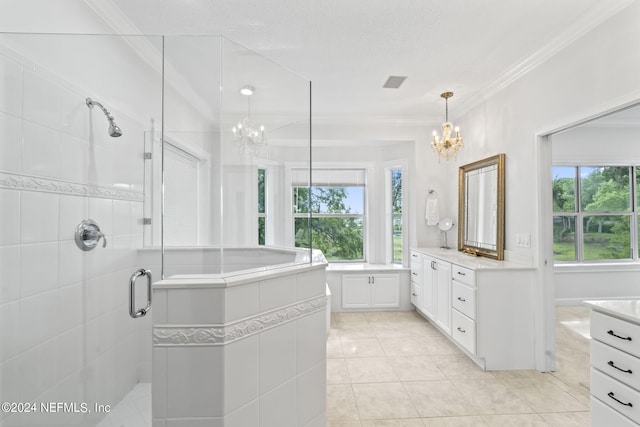 bathroom with an enclosed shower, ornamental molding, a notable chandelier, and vanity