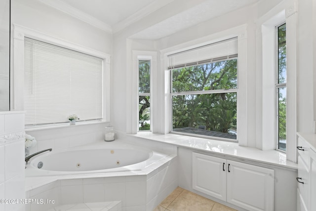 bathroom with ornamental molding, tile patterned flooring, and tiled tub