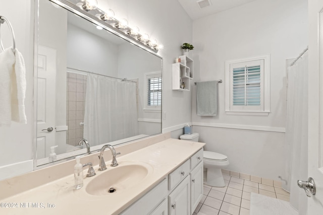 bathroom with vanity, curtained shower, tile patterned floors, and toilet