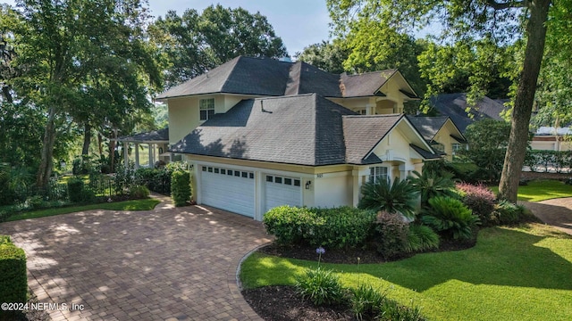 view of side of home with a garage and a yard