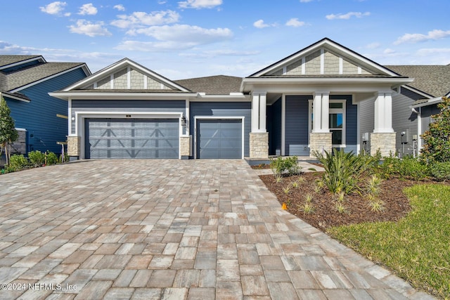 view of front of property featuring a garage