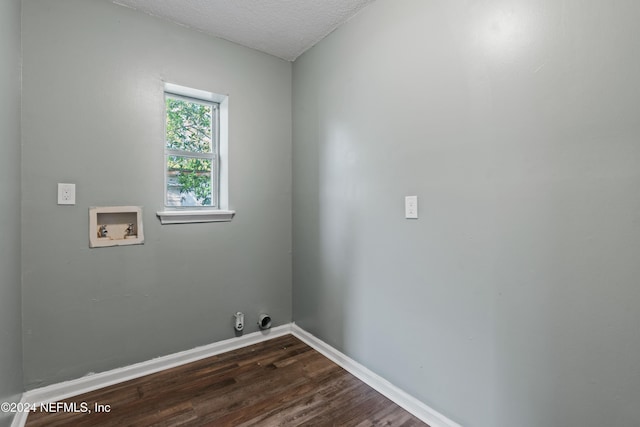 clothes washing area with hookup for a washing machine, dark wood-type flooring, and a textured ceiling