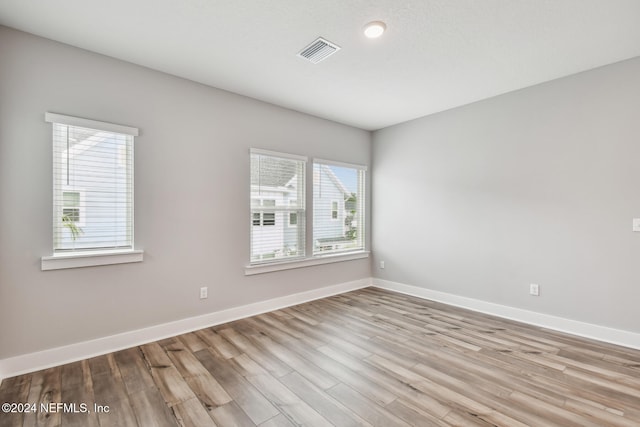 spare room featuring light wood-type flooring