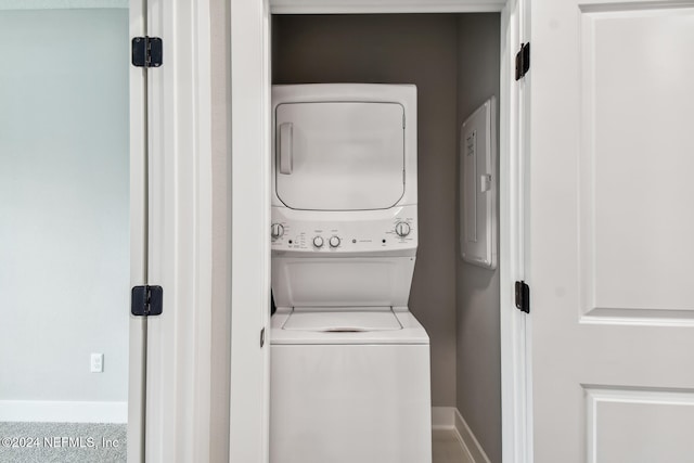 washroom with stacked washer / dryer