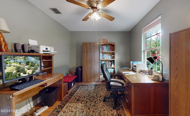 office featuring ceiling fan and a textured ceiling