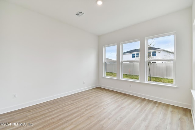 unfurnished room featuring light hardwood / wood-style flooring