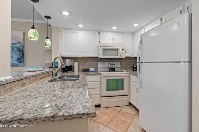 kitchen with kitchen peninsula, white cabinetry, sink, and white appliances