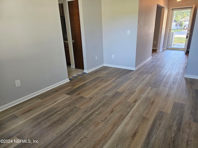 spare room featuring dark hardwood / wood-style flooring