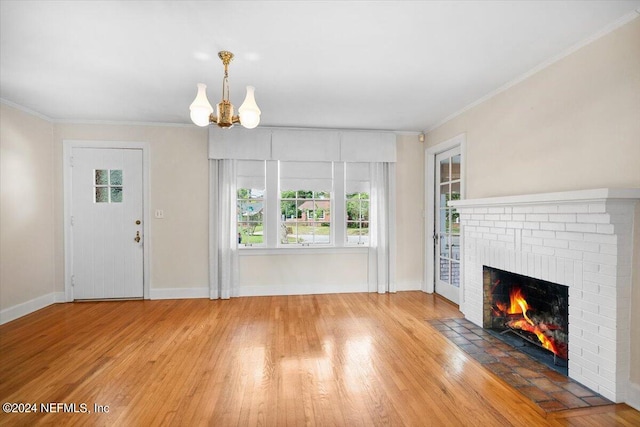 unfurnished living room featuring a wealth of natural light, light hardwood / wood-style flooring, and a fireplace