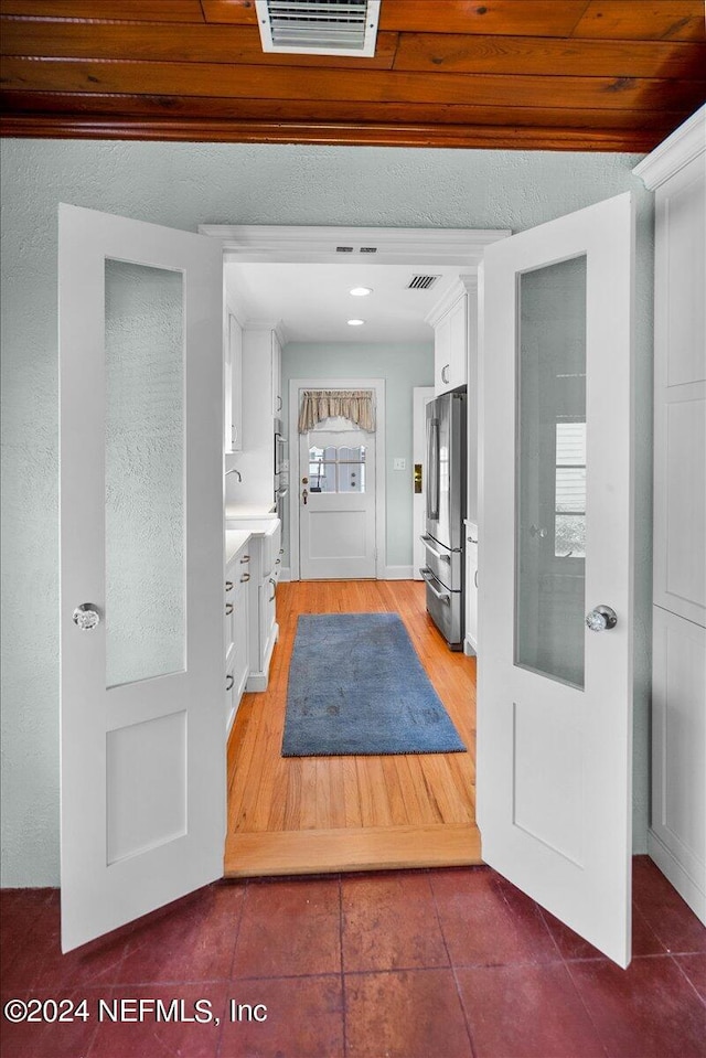 foyer featuring hardwood / wood-style floors and sink