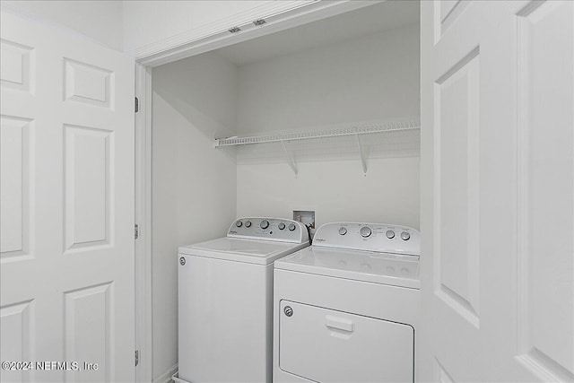 washroom with washer and clothes dryer