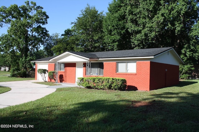 ranch-style home with a front yard