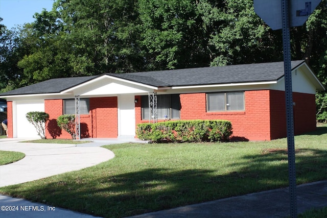 ranch-style home with a garage and a front yard