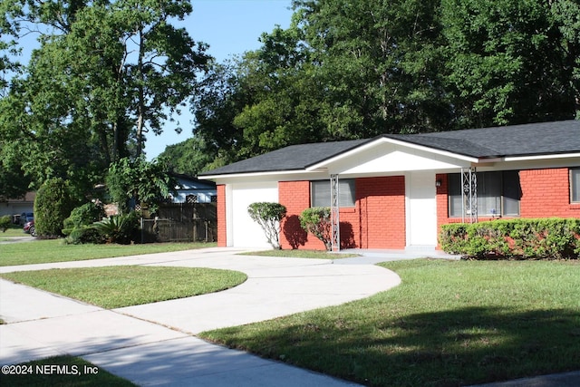 ranch-style house with a front lawn and a garage