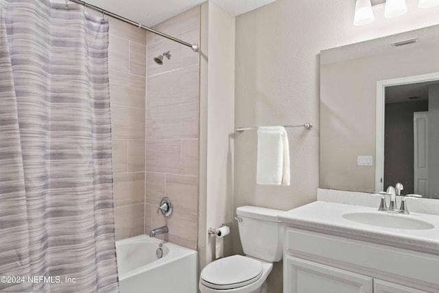 full bathroom featuring shower / bath combo with shower curtain, vanity, and toilet