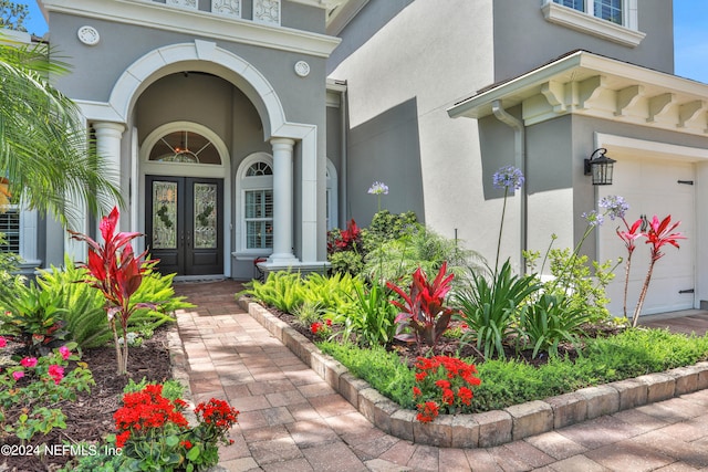 property entrance with french doors and a garage