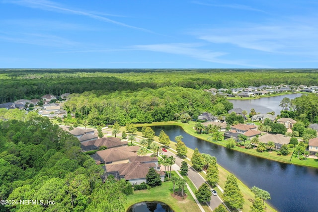 drone / aerial view featuring a water view and a residential view