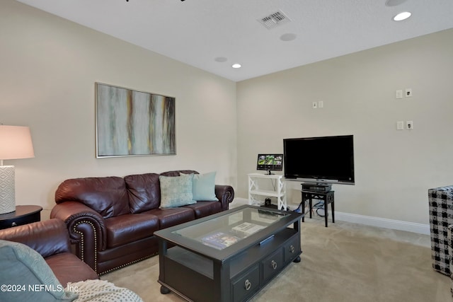 living room with baseboards, visible vents, light carpet, and recessed lighting