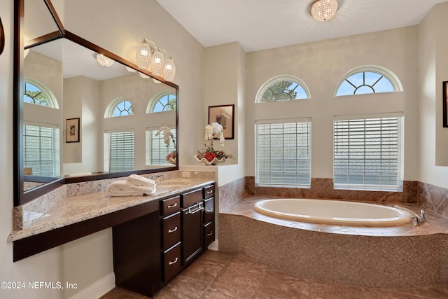 full bathroom featuring vanity and a bath