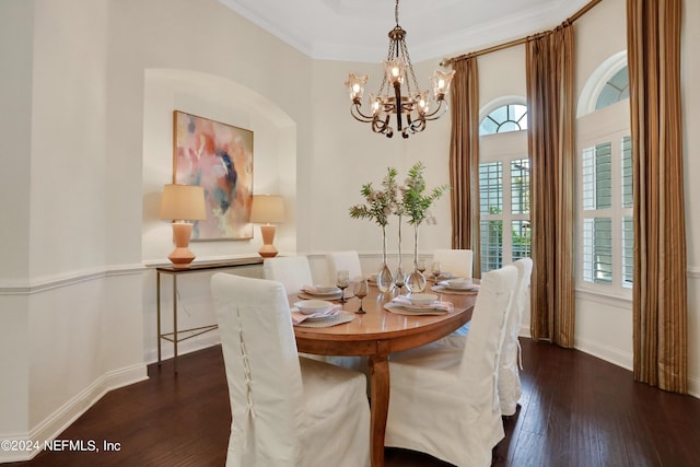 dining room featuring crown molding, a chandelier, baseboards, and dark wood-style flooring