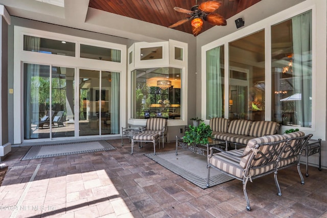 view of patio / terrace with an outdoor living space and a ceiling fan