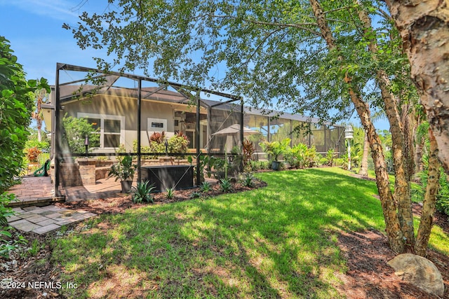 view of yard featuring a lanai