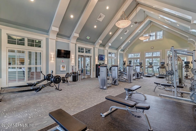 exercise room featuring carpet flooring, high vaulted ceiling, and french doors