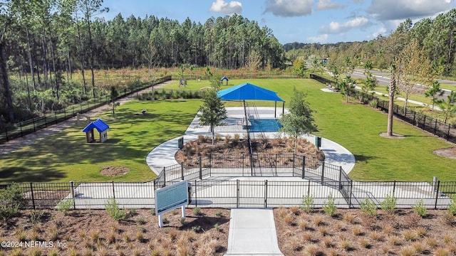 view of property's community with a gazebo and a yard