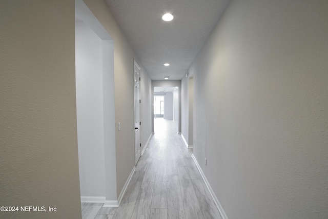 hallway featuring light hardwood / wood-style flooring