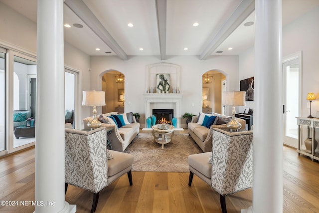 5275 Bentpine Cove Rd, Jacksonville, FL 32224 - living area featuring arched walkways, beamed ceiling, light wood-type flooring, and recessed lighting