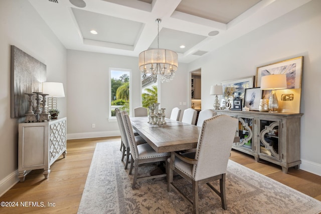 5275 Bentpine Cove Rd, Jacksonville, FL 32224 - dining area with coffered ceiling, a chandelier, baseboards, light wood-style flooring, and beam ceiling