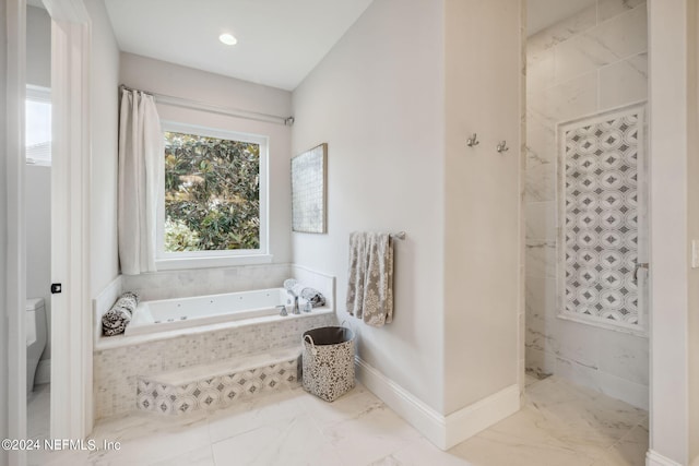 5275 Bentpine Cove Rd, Jacksonville, FL 32224 - full bath featuring a garden tub, marble finish flooring, toilet, and baseboards